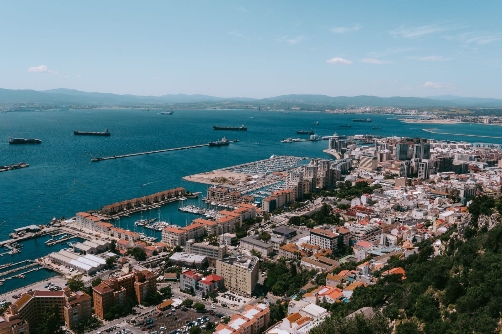 A stunning aerial view of Gibraltar city and its harbor, showcasing the vibrant coastal landscape.